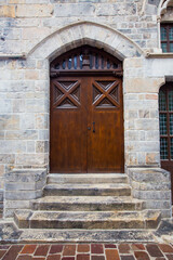 Closeup of an old door of a city hall in Ypres, Belgium