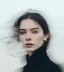 Portrait of a woman with flowing hair and a serene expression captured during a breezy day by the ocean at dusk