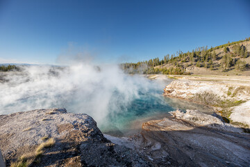 A large body of water with steam rising from it