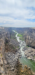 A river flows through a rocky canyon