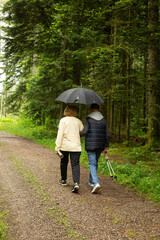 couple walking in the rain