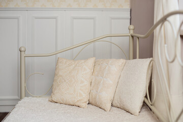 Closeup of three pillows on a bed
