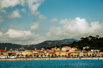 Nice, France - July 2, 2014: Views from the water of the buildings, homes and beaches along the shores surrounding Nice, France, in the French Riviera
