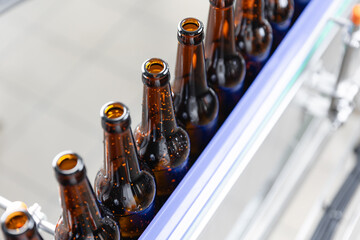 Top view Beer factory bottling line with glass bottles in production process