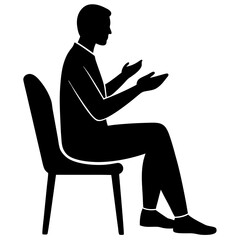 Silhouette of a Person Sitting and Gesturing with Hands