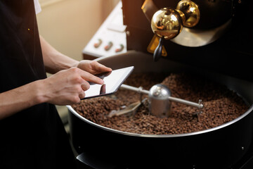 Coffee factory machinery with caucasian male worker managing operations