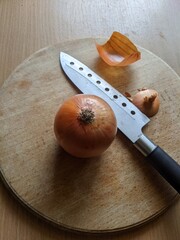 Onion and Knife on Cutting Board