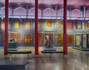 Religious artifacts and antique prayer rugs displayed inside Mevlâna Museum, showcasing rich cultural legacy of Islamic heritage in Konya, Turkey