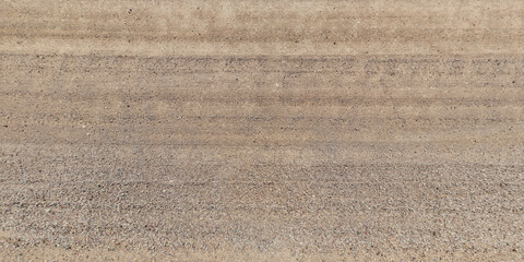 top view of gravel road surface and grass shoulder