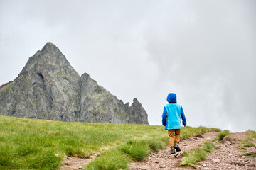 Young hiker with a mountain in the background