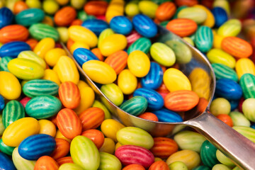 Candy. Close-up of coloured dragee balls. Sweets. Background.