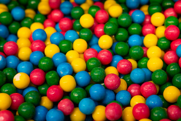 Candy. Close-up of coloured dragee balls. Sweets. Background.