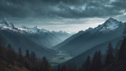 Snow-capped mountain range with a valley and forested slopes under a dark cloudy sky. Nature landscape with towering peaks and dramatic weather.