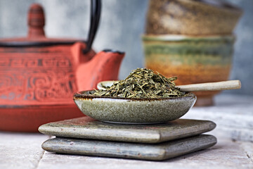Dried Green Tea Leaves on Bright Background. Close up.	