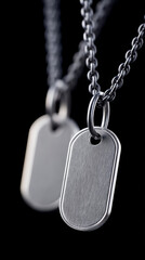 Dog tags swinging gently on chain against black background for military tribute or memorial design