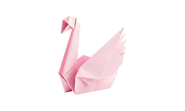 A delicate pink origami swan a symbol of grace and artistry gracefully folded and presented on black