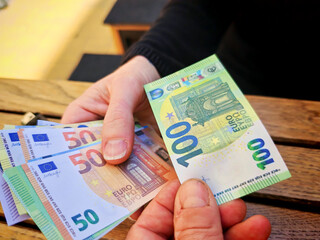 euro bank notes, paying in the european union