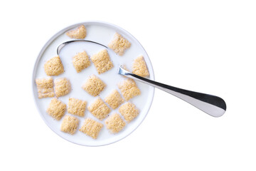 bowl with corn pillows with milk isolated on white background. Top view.