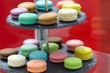 Colored macaroon cookies on the shelf