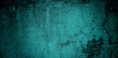 A textured background featuring a deep teal color with a distressed, grunge appearance. The surface shows variations in tone and subtle patterns, creating an abstract and moody aesthetic.