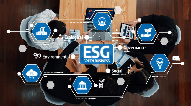 A diverse group of professionals engaged in a collaborative meeting focused on ESG strategies for green business growth. They analyze data and innovative solutions for sustainability. Amity