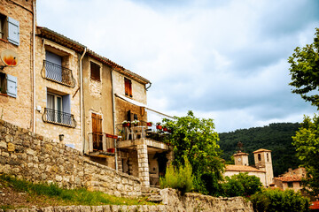 Obraz premium Seillans, France - July 3, 2014: A rustic building along an alleyway in the provencal village of Seillans, France 