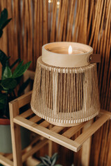Contemporary Japanese‑style spa interior with bamboo candle holder and modern floral decoration