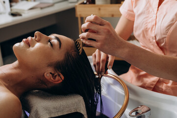 Scalp spa massage using comb tools for relaxation and head‑care treatment