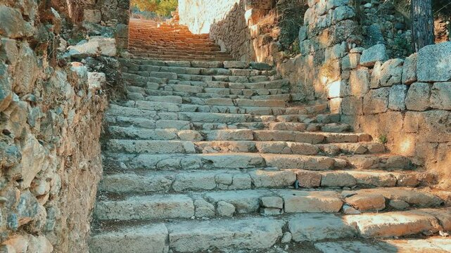 Ruins of the ancient Roman port city of Siedra in Alanya, Antalya, Turkey. The street and ruins of the ancient abandoned ancient city of Siedra on the Mediterranean coast. 4К	