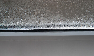 drops of water run down the glass.