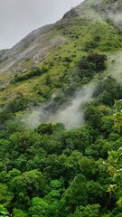 Obraz premium Mist rolling out of a mountain 