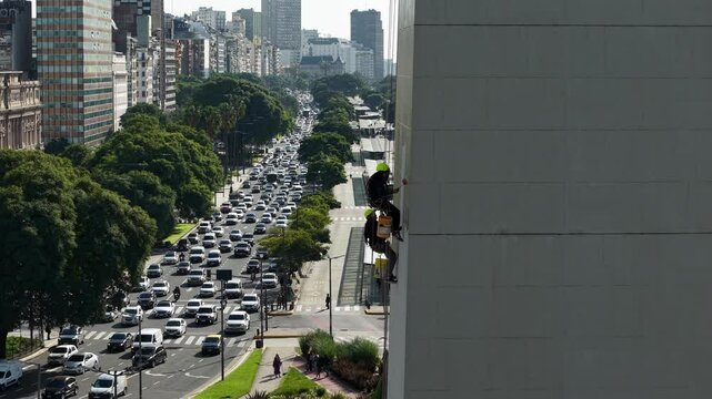 Workers Hanging from the Iconic Obelisk in Buenos Aires &ndash; Aerial View of Monument Restoration in Action