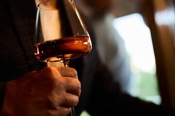 Elegant man  holding wine glass