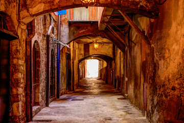 Villefranche, France - July 2, 2014: A rustic covered alley way in Villefranche, France, in the French Riviera
