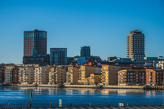 Modern waterfront high-rise buildings.