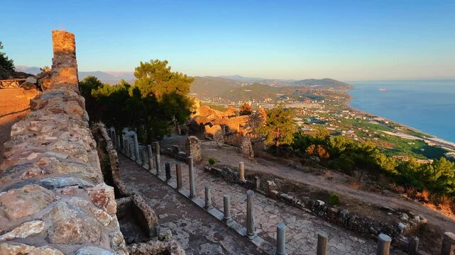 Ruins of the ancient Roman port city of Siedra in Alanya, Antalya, Turkey. The street and ruins of the ancient abandoned ancient city of Siedra on the Mediterranean coast. 4К	