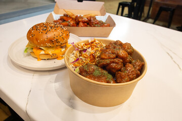 Korean deep dried chicken on white rice with soy garlic sauce.