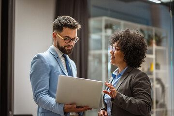 businessman use laptop for showing work results to his boss in office