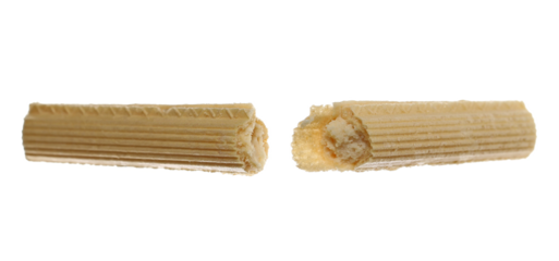 Broken wafer stick with coconut stuffing isolated on white background