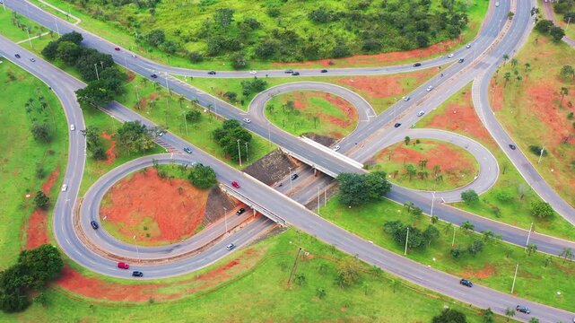Aerial view of cars passing through one of Bras&iacute;lia's avenues with its many junctions.