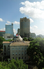 Aerial view of the downtown Raleigh NC skyline with the state capitol building in the foreground