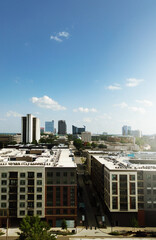 View of downtown Raleigh skyline with Seaboard Station apartments and restaurants in the foreground
