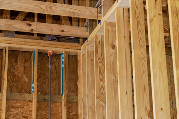 Newly built framework shows wooden studs beams in house under construction