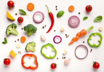 Healthy flat lay of sliced vegetables composition isolated on white background