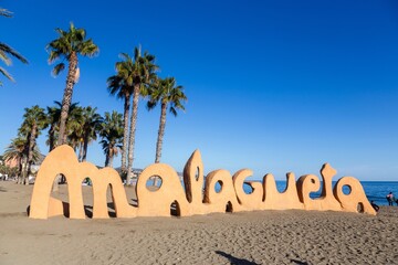 La Malagueta Sign, Popular Urban beach by City Harbour, Mediterranean Blue Skyline, Costa Del Sol Waterfront, Malaga Spain
