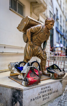 Statue of a Hamal, porter, worker straining under a heavy load, Istanbul, Turkey