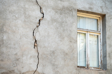 Closeup of cracked wall of house destroyed during strong earthquake in Turkey. Damage on building. 