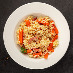 Rice meat and vegetables pilaf fresh delicious gourmet food background on the table rustic food top view copy space