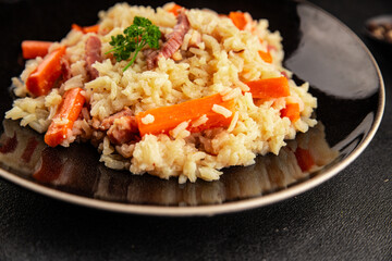Rice meat and vegetables pilaf fresh delicious gourmet food background on the table rustic food top view copy space