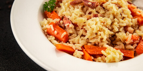 Rice meat and vegetables pilaf fresh delicious gourmet food background on the table rustic food top view copy space